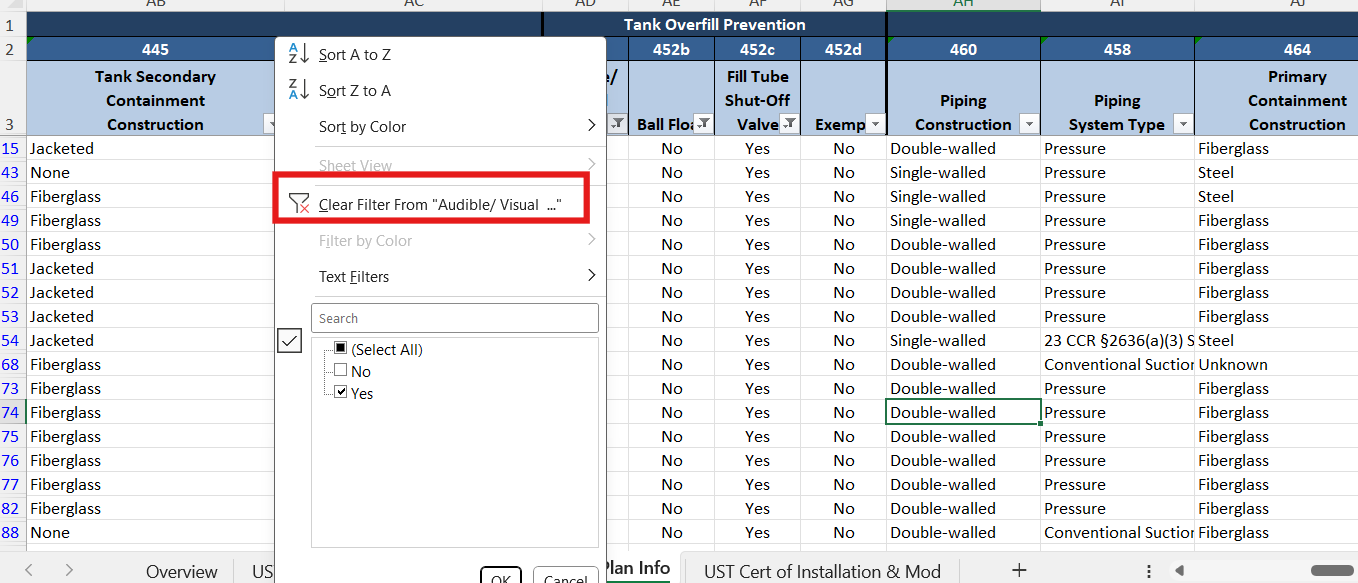 Screenshot of the 'UST Tank and Monitoring plan Info' tab. A red box highlights the 'Clear Filter from [Column Name]' option, which column 452a (Audible/Visual Alarm) shown as an example.